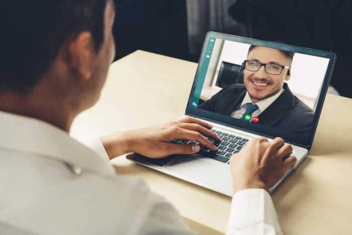 Video call business people meeting on virtual workplace or remot Photo of man on video call illustrates blog: ustratesHow to Be a Better Communicator This 2021