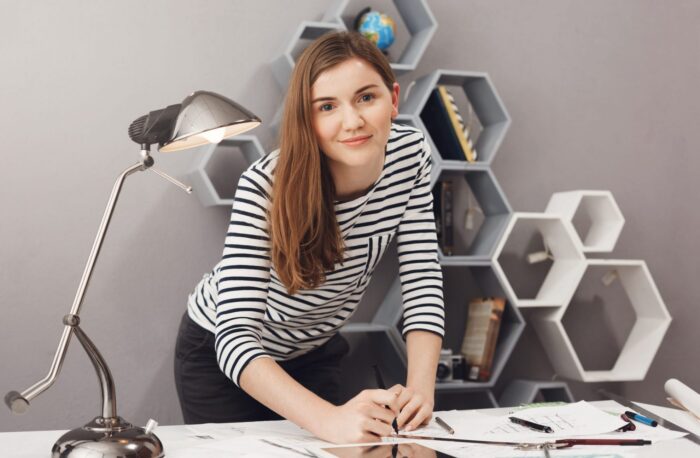 Image of woman drawing illustrates blog: How to Promote Creativity in the Workplace