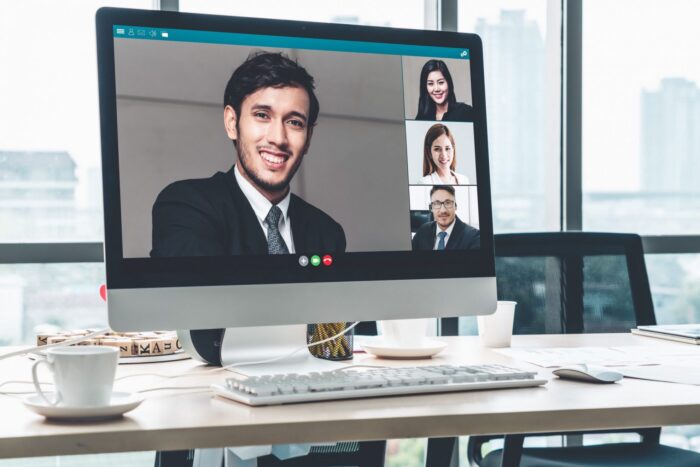 Image of people on video call illustrates blog:How to Conduct Job Interviews Remotely