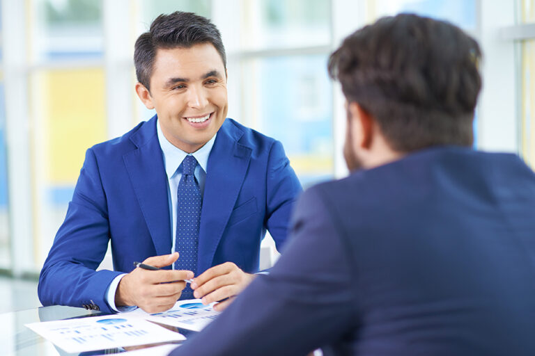 Image of smiling employee illustrates blog "Tips to Win the War for Talent"