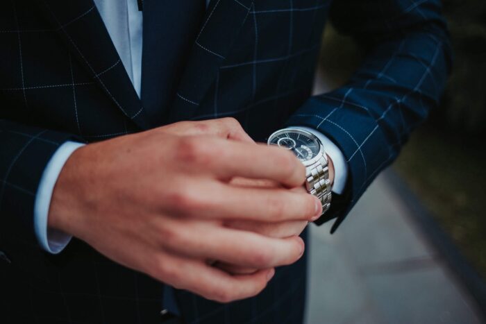 Photo of man looking at his wristwatch illustrates blog: "About The Pomona Chamber of Commerce At the Pomona Chamber of Commerce, our mission is to keep you up to date with the most relevant developments in business management and administration so you and your company can take advantage of new opportunities. Contact us by email (info@pomonachamber.org) telephone (909-622-1256), social media, or click on this link to join and start enjoying the benefits of membership today."