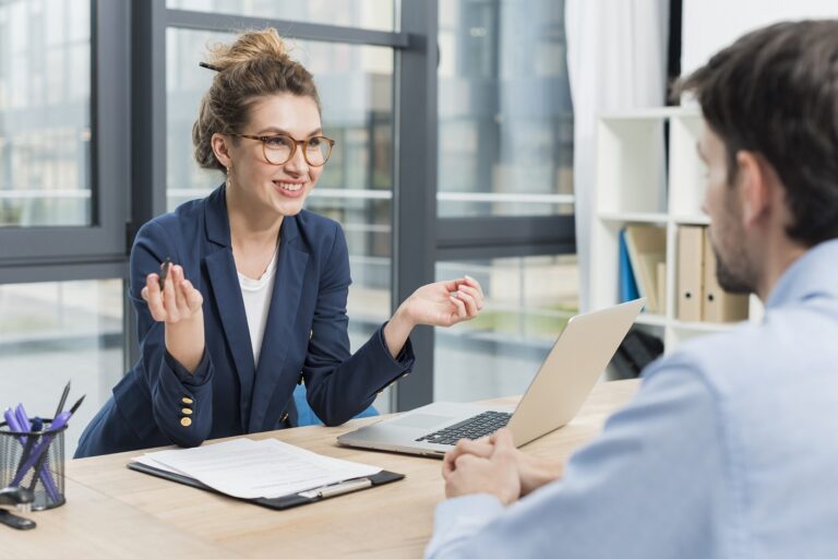 Photo of woman during job interview illustrates blog: Make Sure To Avoid These Mistakes During the Hiring Process"