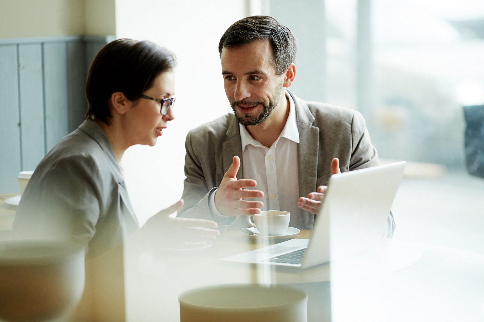 Photo of man and woman talking illustrates blog: "How to Decline a Commitment After You Said “Yes”"