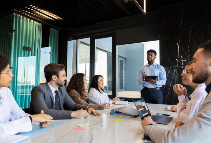 business-strategy-FP Businesspeople during meeting illustrate blog "What Is Business Strategy?"