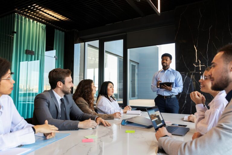 Businesspeople during meeting illustrate blog "What Is Business Strategy?"