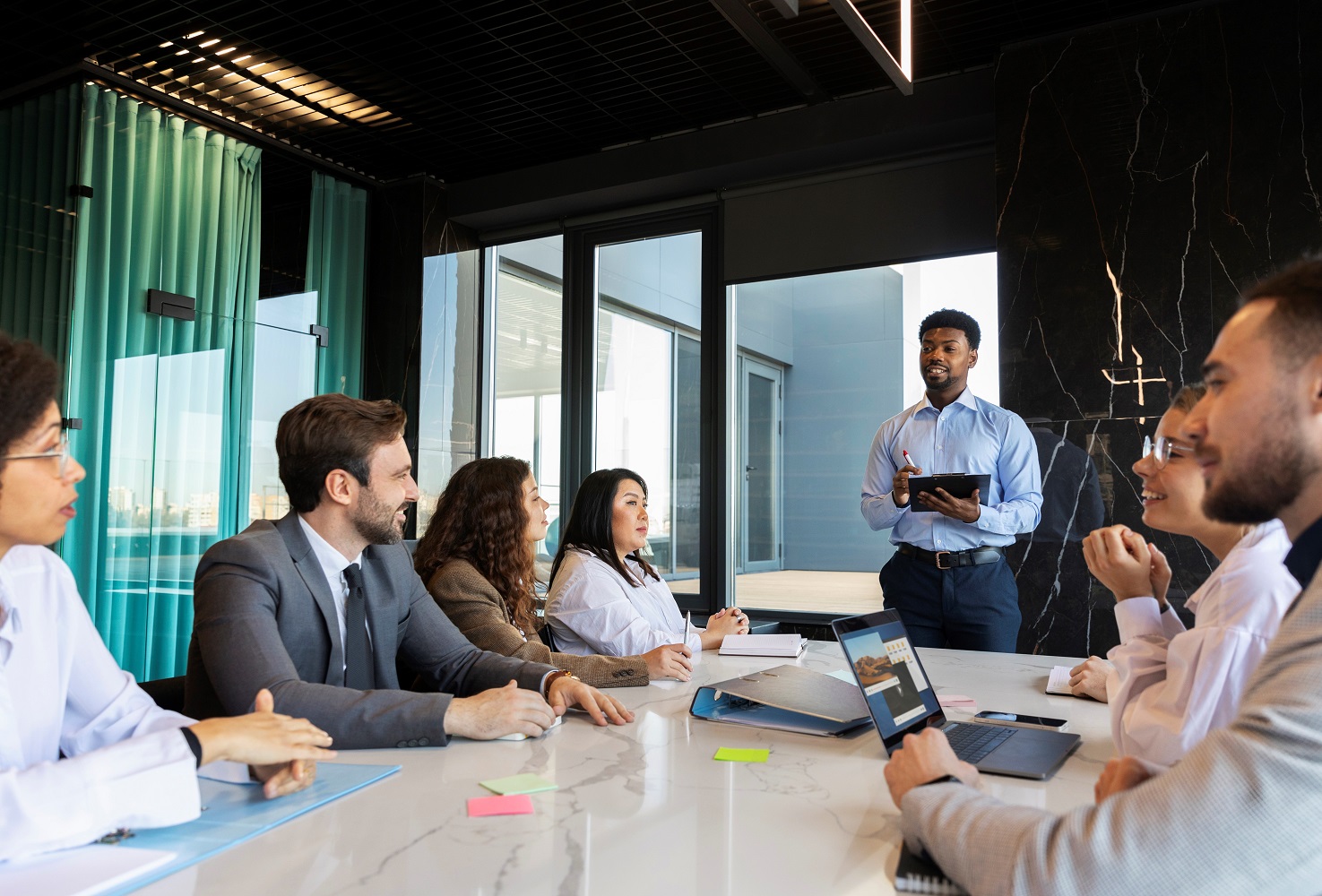 Businesspeople during meeting illustrate blog "What Is Business Strategy?"