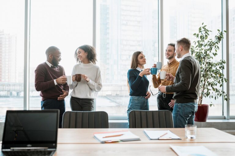 Group of five people networking in office