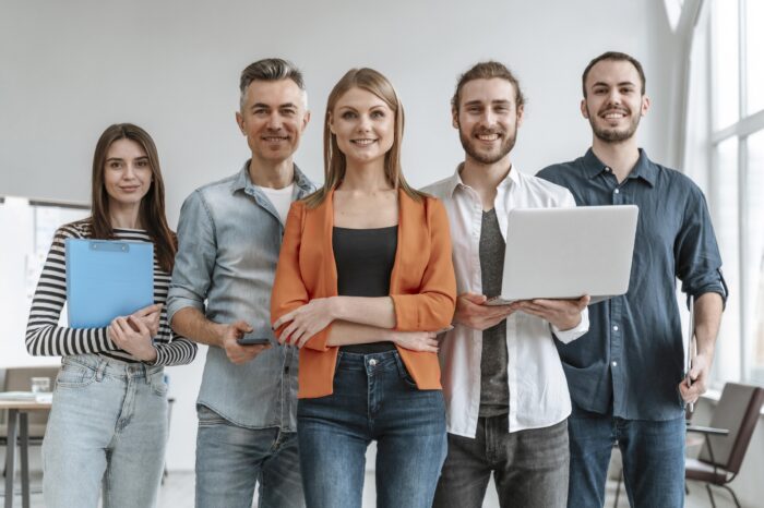 Group of professionals dressed casually illustrates blog "What Are SMART Goals?"