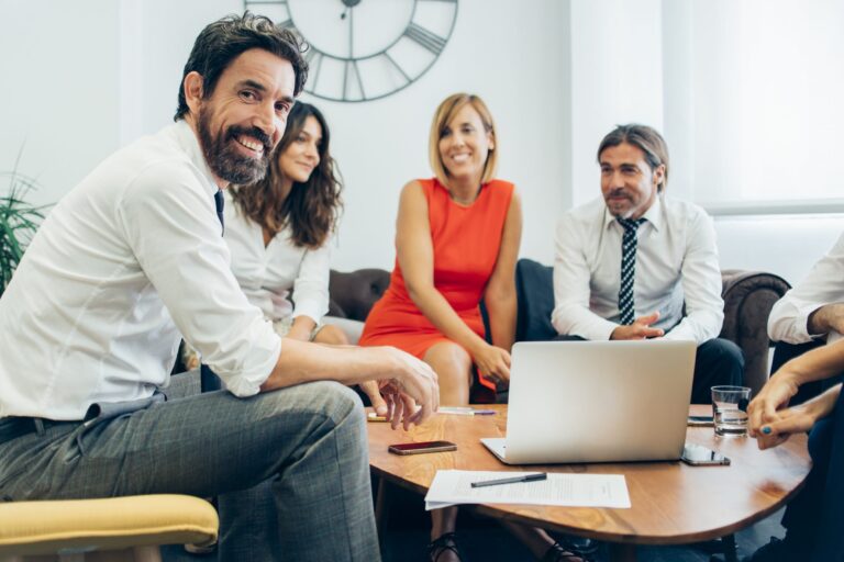 Group of businesspeople dressed casually illustrates blog "5 Things Every Small Business Needs"