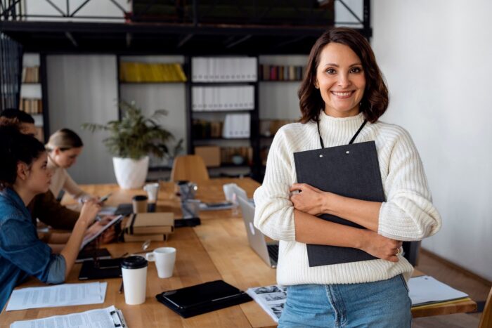 entrepreneur-woman2-FP Woman holding clipboard illustrates blog "How To Find New Business Ideas"