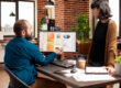 Small business owner using business decision data to review sales and customer trends