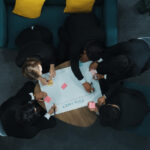 Professionals reviewing collaboration beats competition local strategy and planning documents