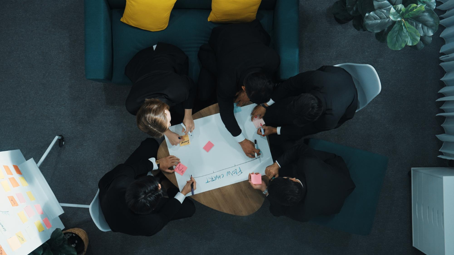 Professionals reviewing collaboration beats competition local strategy and planning documents