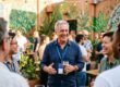 First-time entrepreneur using a business networking guide at a Pomona event
